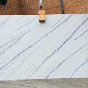 Golden Way (promo Min job 20 sf)  Builder Stone very white  blue/light black veining and, golden sparkles.